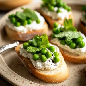 Ricotta Crostini with Peas and Mint